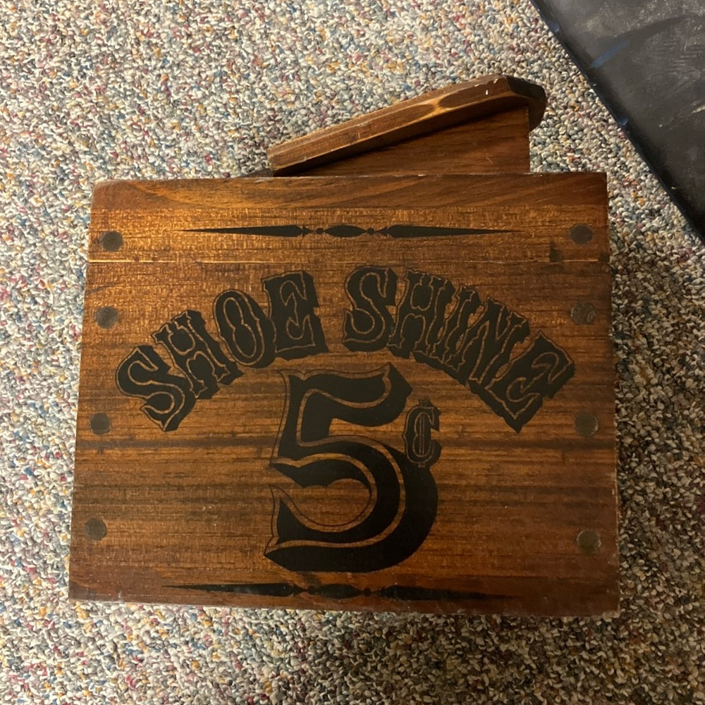 Vintage retro shoe shine box kit with footrest and items inside brush polish